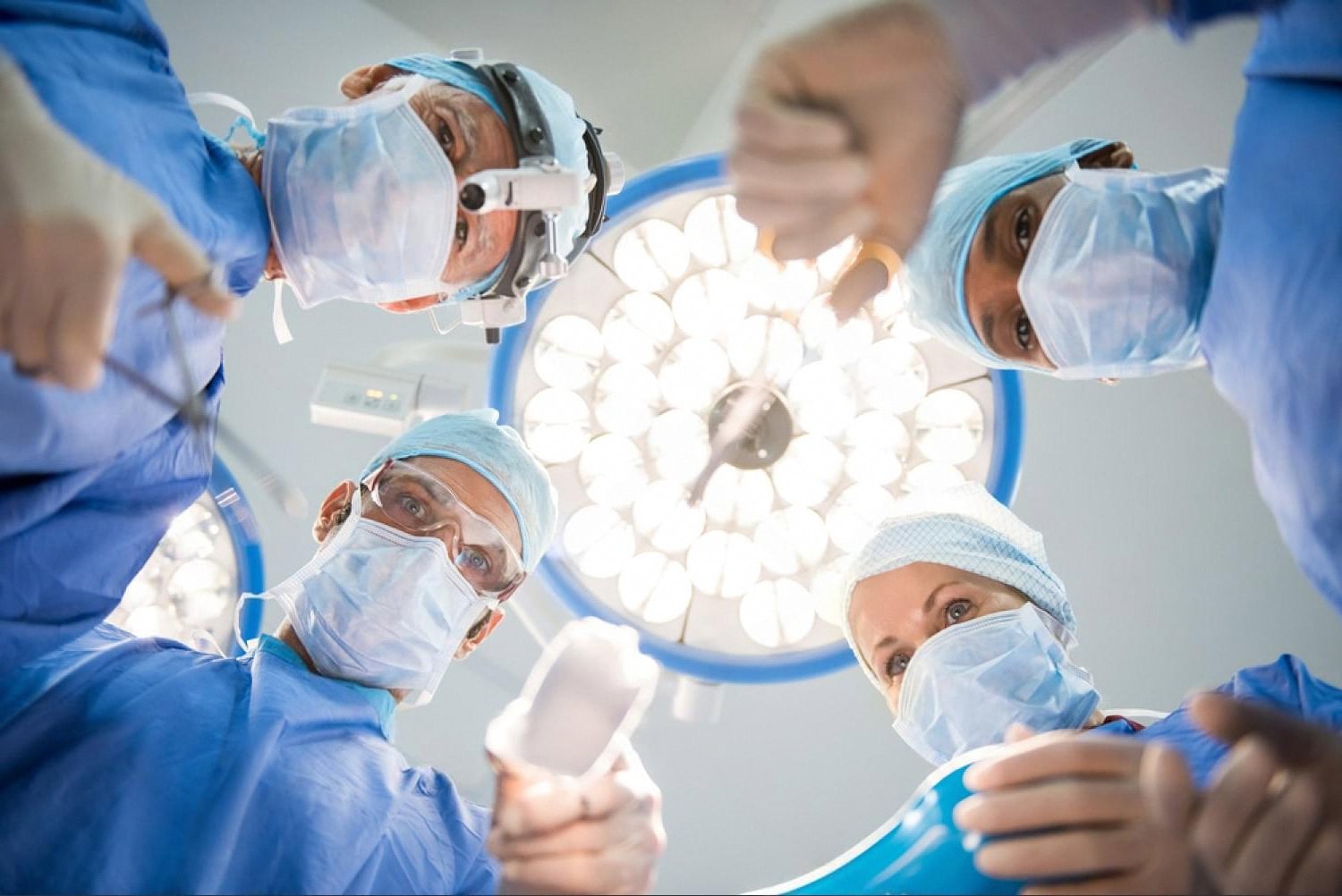 Surgical team viewed from below during a gallstones removal procedure